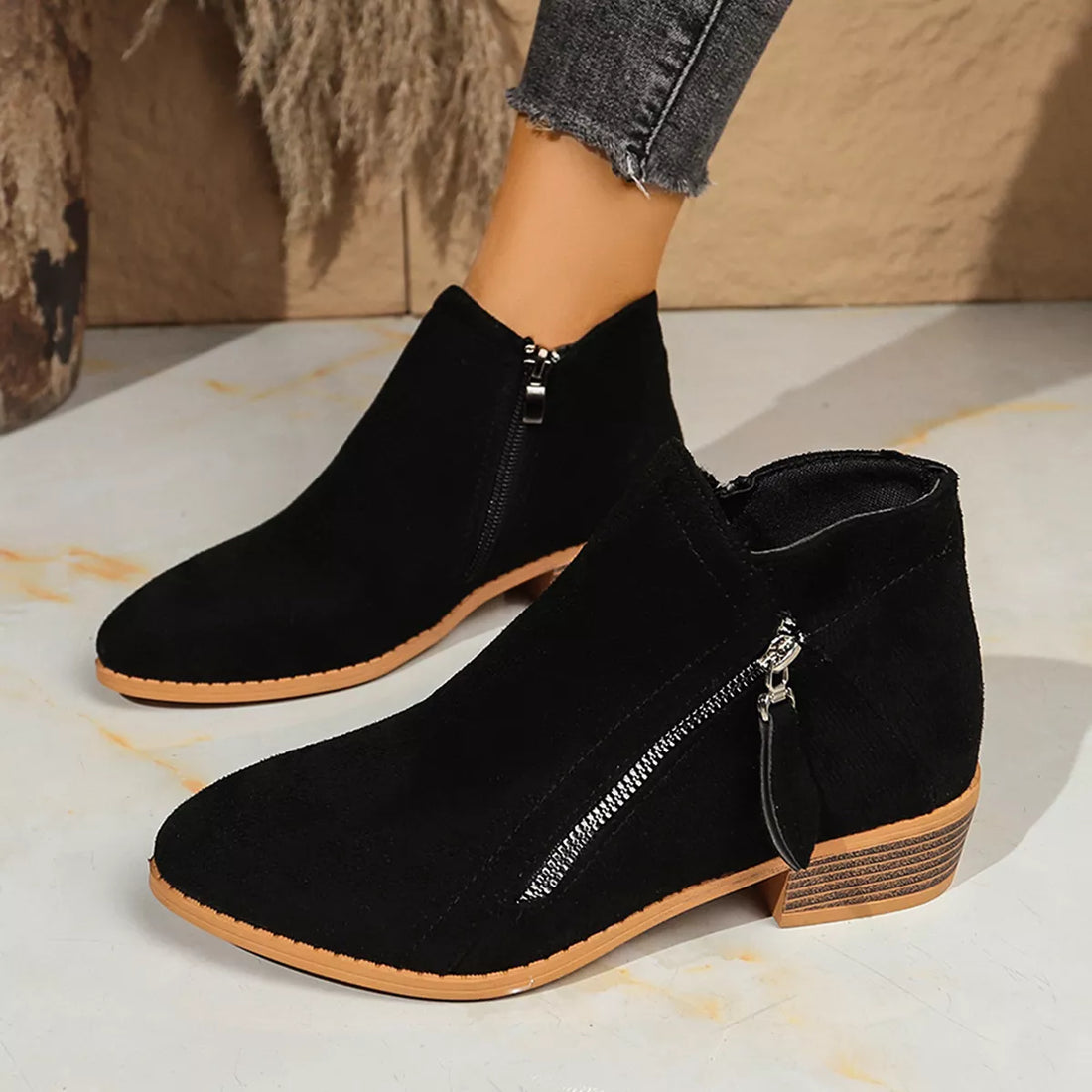 Black point-toe block heeled ankle boots with side zipper and wood-look block heel