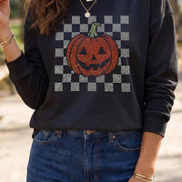Black long sleeve sweatshirt with rhinestone checkerboard pumpkin graphic