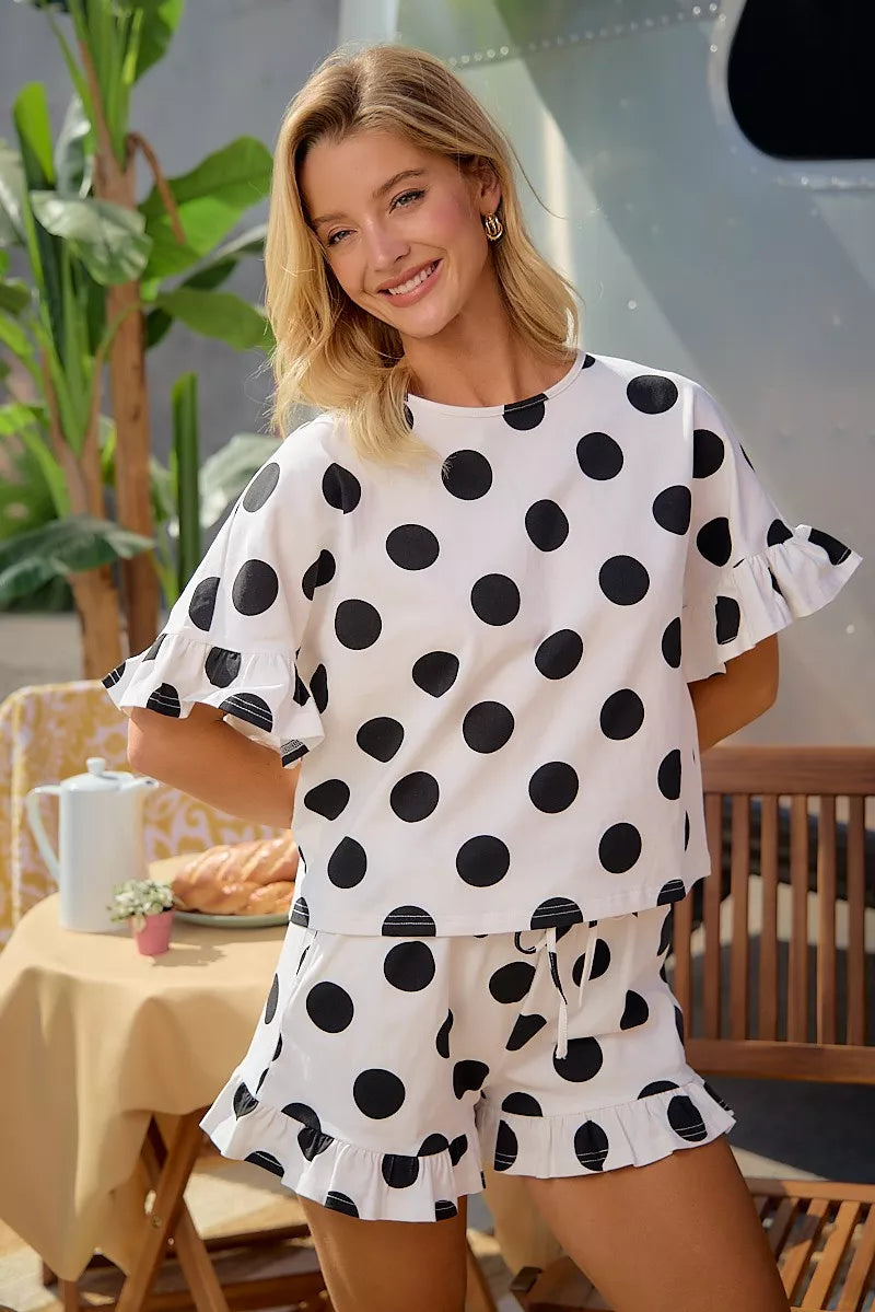 Ivory and black polka dot ruffle top with flared shorts, drawstring waist set