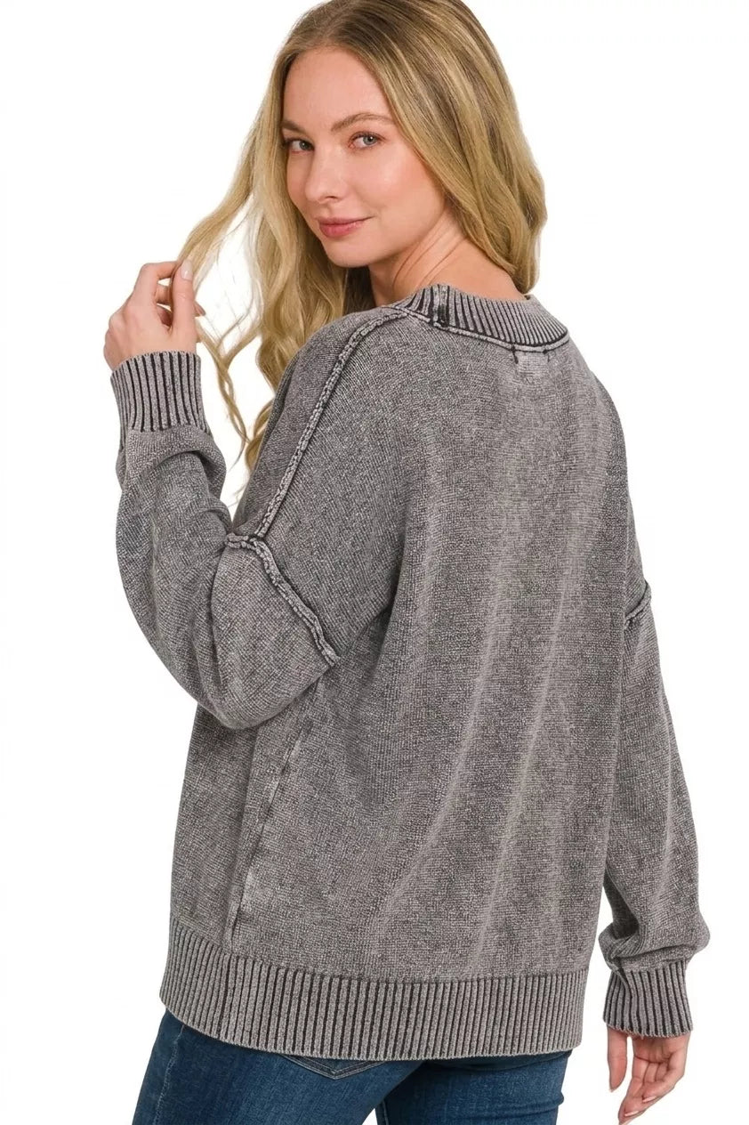 Washed dark gray oversized sweater, deep V-neck, long sleeves with ribbed hem