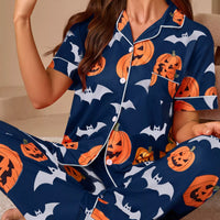 Navy button-down pajama set with pumpkin and bat print, short-sleeve top and matching pants