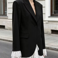 Black one-button blazer with lace-trim hem and front flap pockets