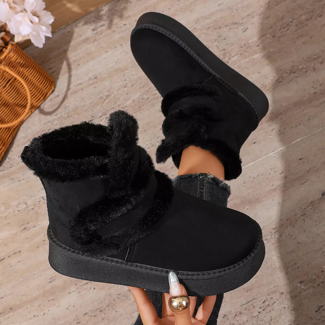 Black round-toe platform boots with wide faux-fur straps and thick platform sole