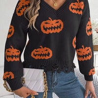 Black V-neck pumpkin sweater, long sleeves, orange jack-o’-lantern intarsia and frayed hem
