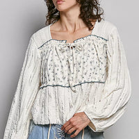 Cream lace square-neck long balloon sleeve top with gathered ruffle neckline, blue trim