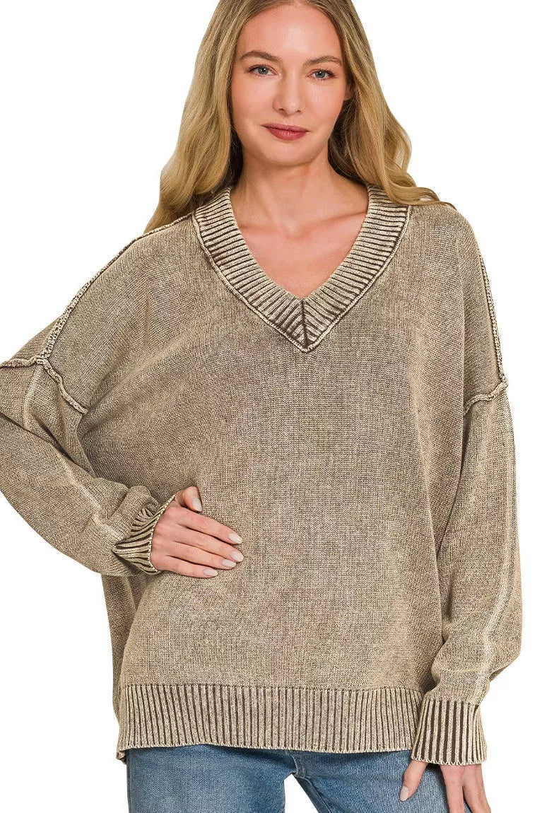 Brown washed oversized sweater with deep V-neck and ribbed knit cuffs