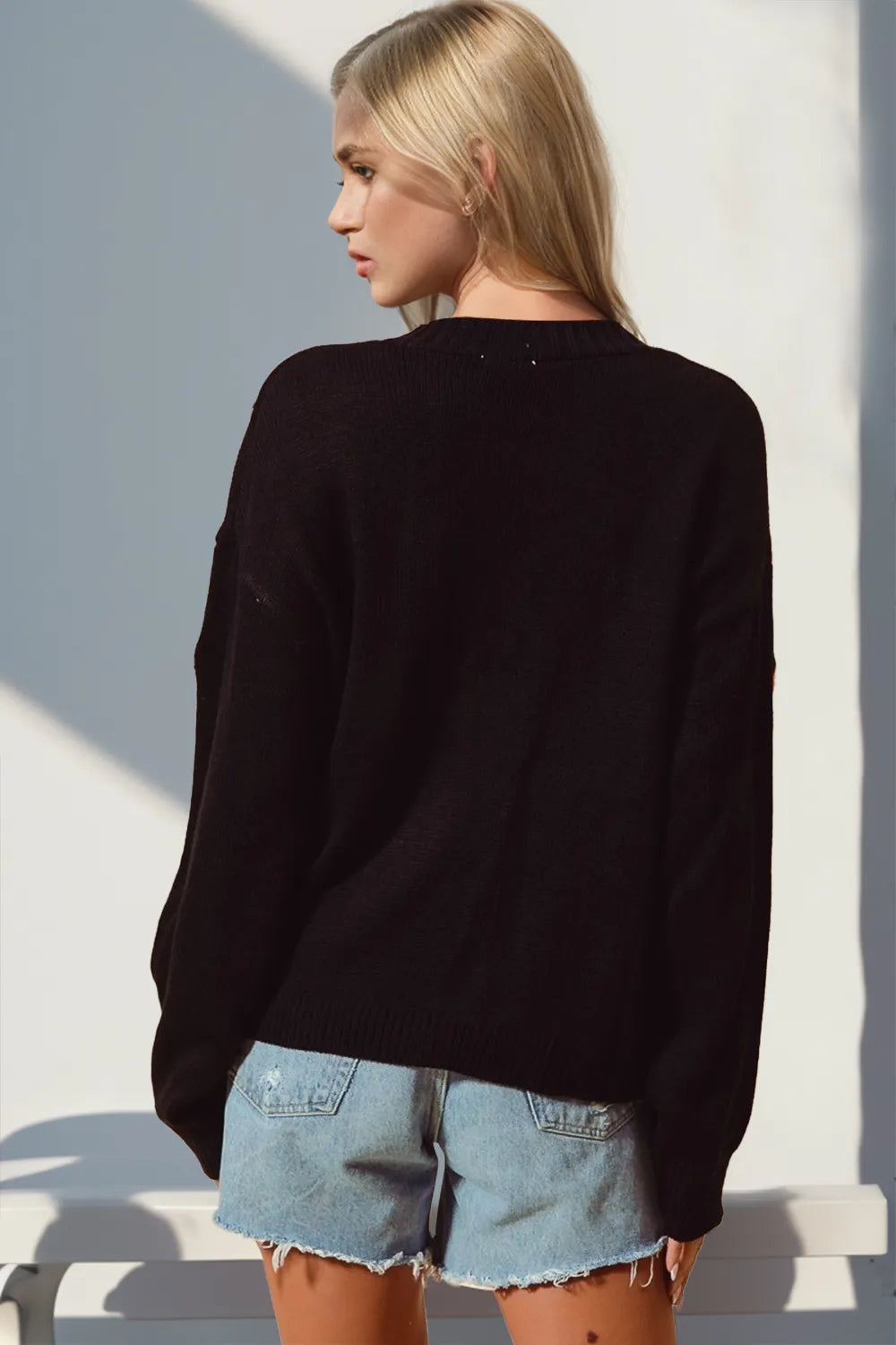 Black long-sleeve cardigan back view