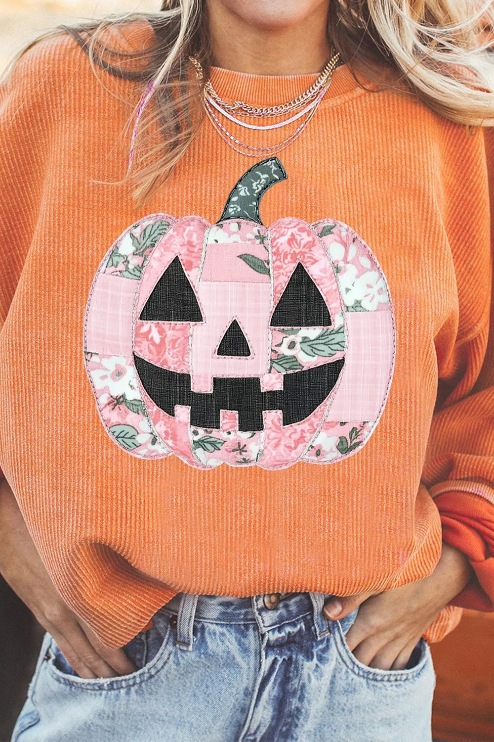 Sherbet orange tunic sweatshirt with corded ribbed knit and patchwork pumpkin graphic