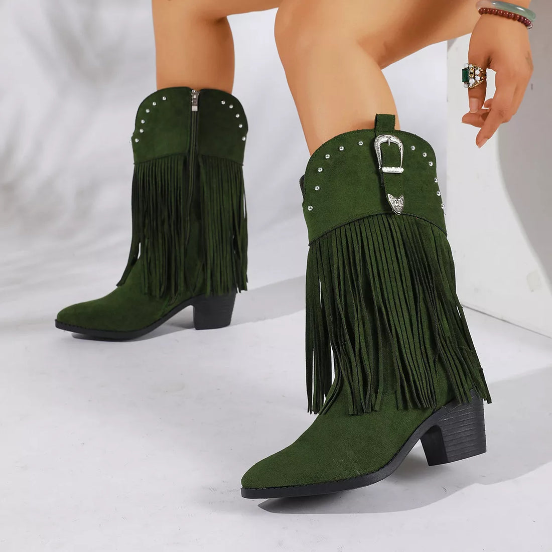 Green fringe round-toe block-heel boots with studded strap and ankle buckle