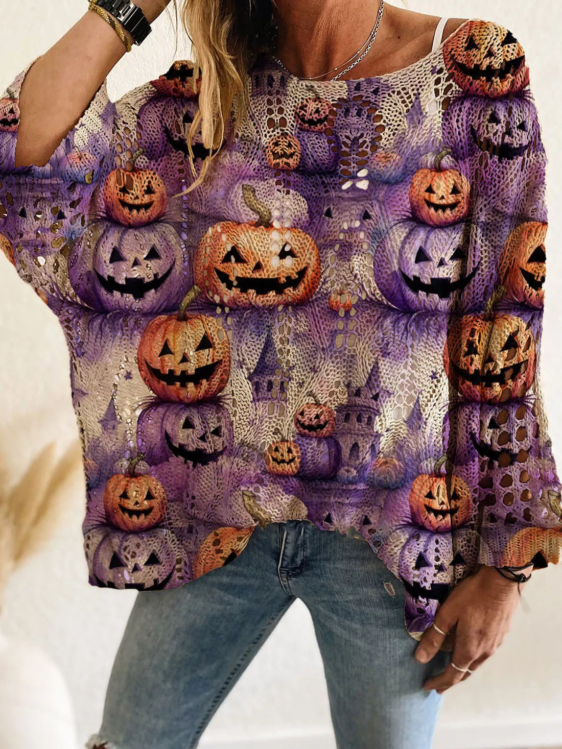 Plus size loose knit cover-up with purple base and repeated orange jack-o&