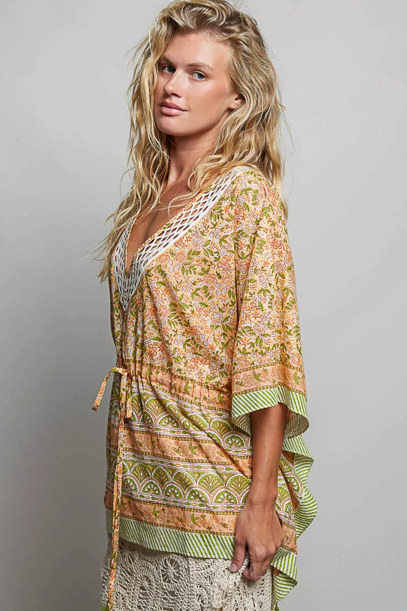 Floral print V-neck blouse with tie-front and relaxed quarter sleeves, green trim