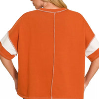 Burnt orange striped terry top, crew neck, exposed center back seam