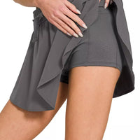 Ash grey woven active skort detail: elastic waist, tie bow, layered skirt