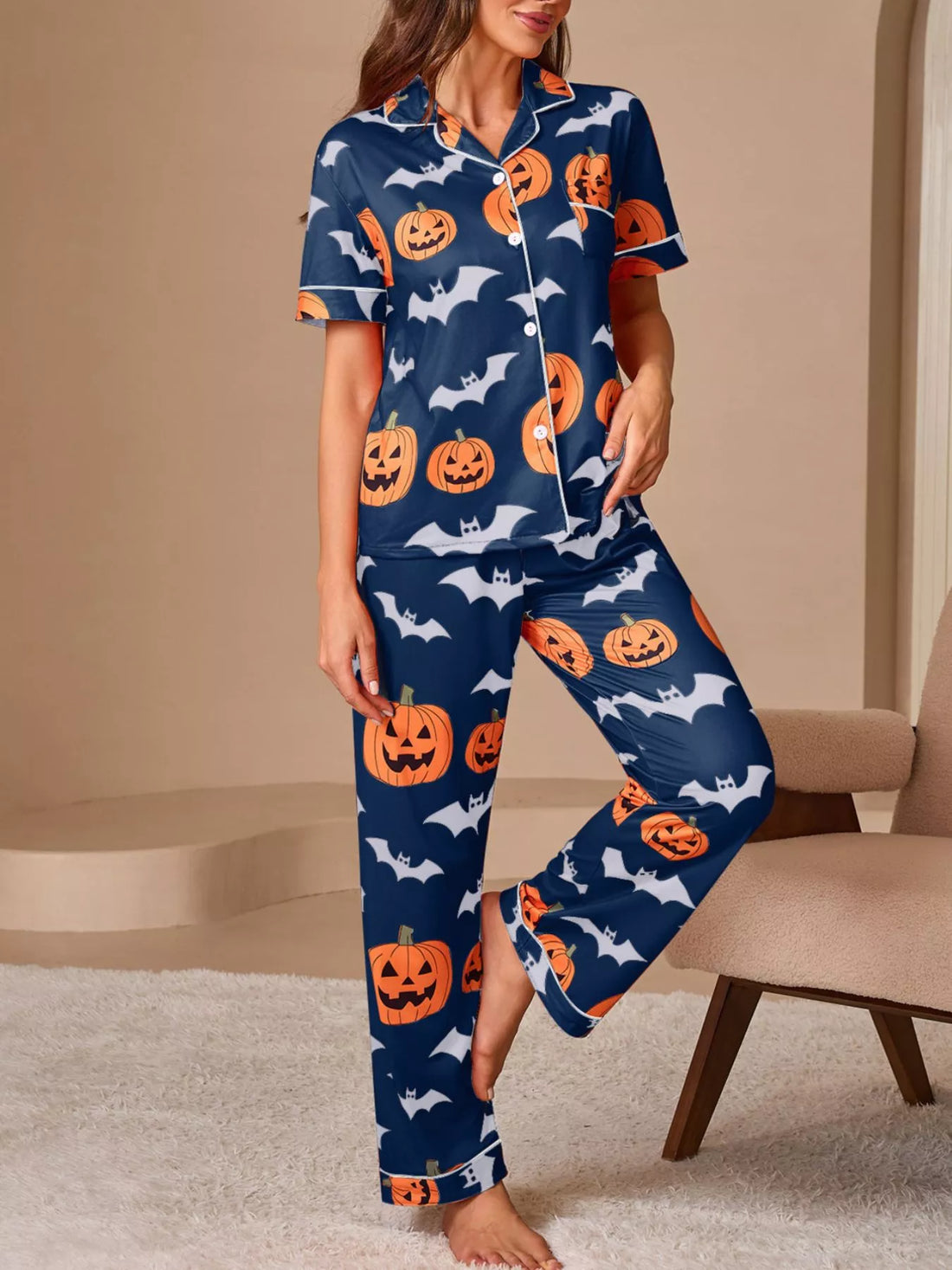 Navy short-sleeve button pajama set with orange pumpkins and bats, matching lounge pants