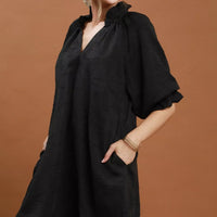 Black V-neck textured dress with loose fit and draped flutter sleeves