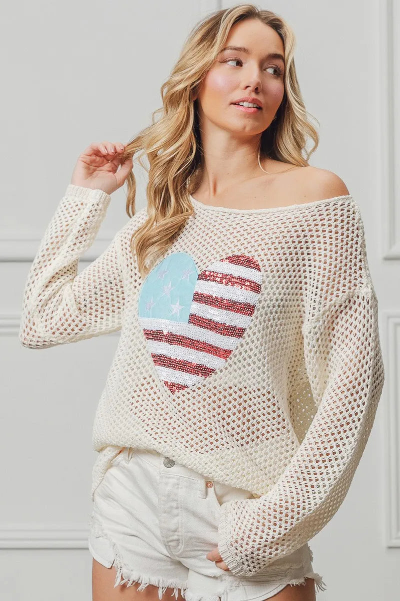 Off-white sequin heart knit top with American flag motif, long sleeves.