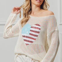 Off-white sequin heart knit top with American flag motif, long sleeves.