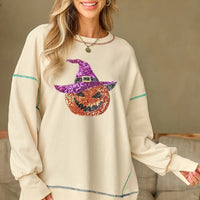 Ivory long-sleeve sweatshirt with sequin pumpkin graphic and contrast trim at cuffs