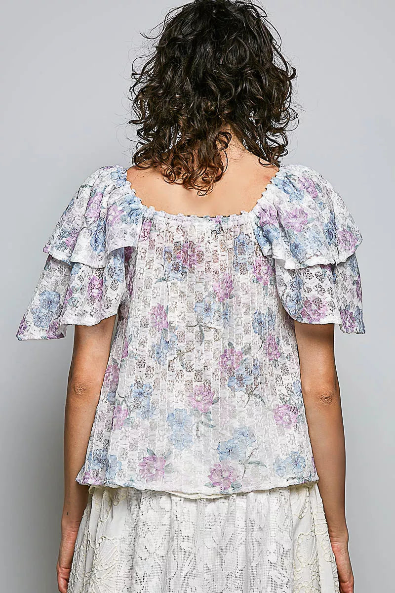 Back view floral ruffle short-sleeve blouse with lace-trim neckline, off-white pastel print