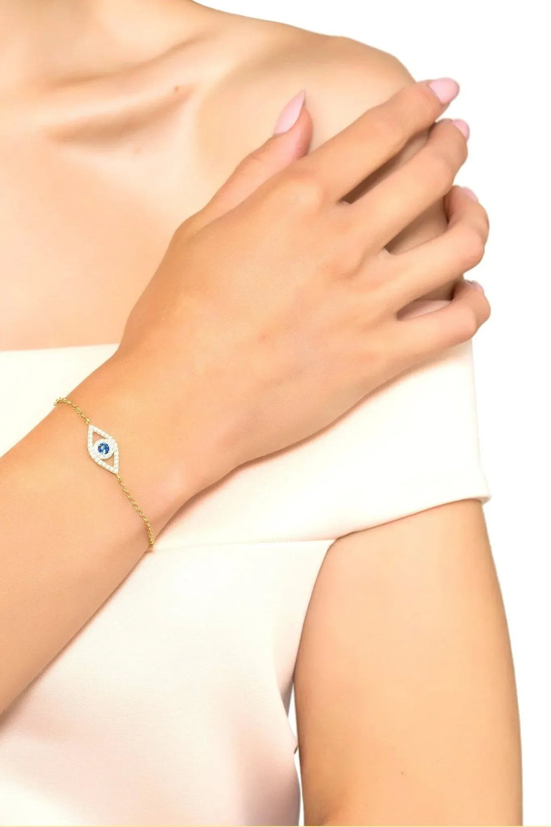 Rose-gold evil eye bracelet with blue eye charm and adjustable chain