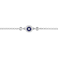 Silver evil eye charm bracelet close-up, dark blue enamel eye at center with beads