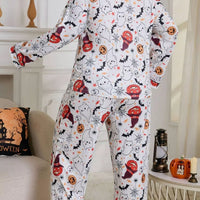 Plus size Halloween pajama set, white long-sleeve top and matching pants with allover print