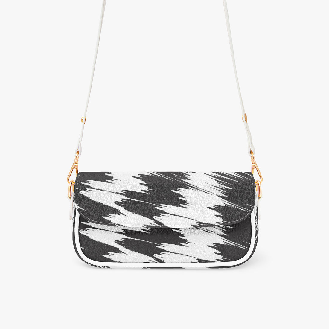 Black and white patterned shoulder bag with curved flap and gold chain strap