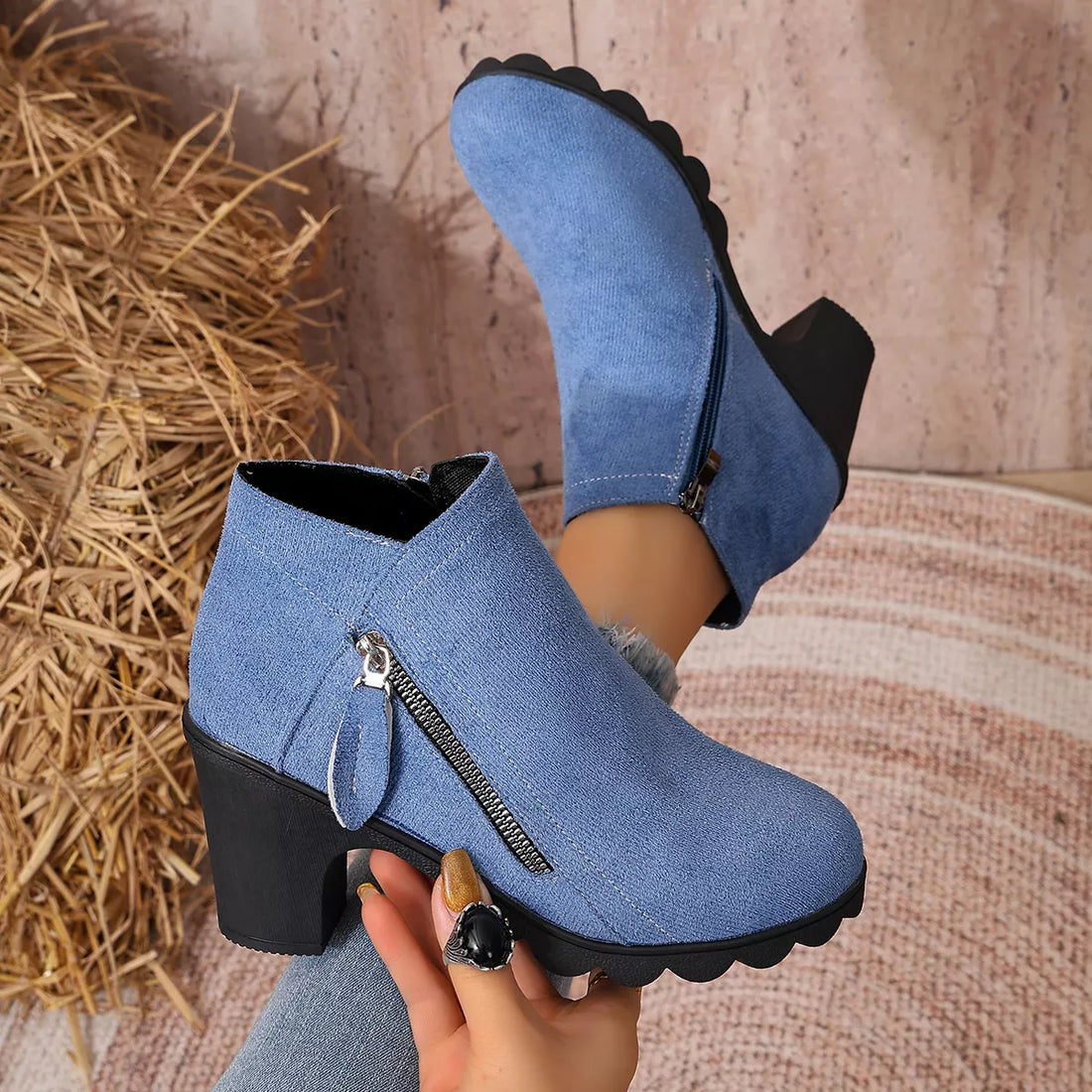 Blue suede block-heel ankle boots with round toe, side zipper, and scalloped cuff