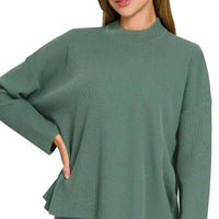 Teal-green crew-neck sweater top with long sleeves and slightly flared hem