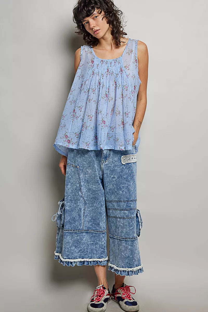 Blue floral pleated cotton sleeveless top with round neckline, long pleated hem