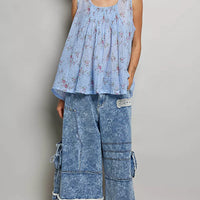 Blue floral pleated cotton sleeveless top with round neckline, long pleated hem