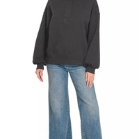 Black fleece half-snap sweatshirt with stand collar and long puff sleeves