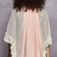 Women’s back view of baby pink pleated shirt with lace crochet patch sleeves