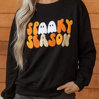 Black long-sleeve crewneck sweatshirt with embroidered spooky seasonal text front
