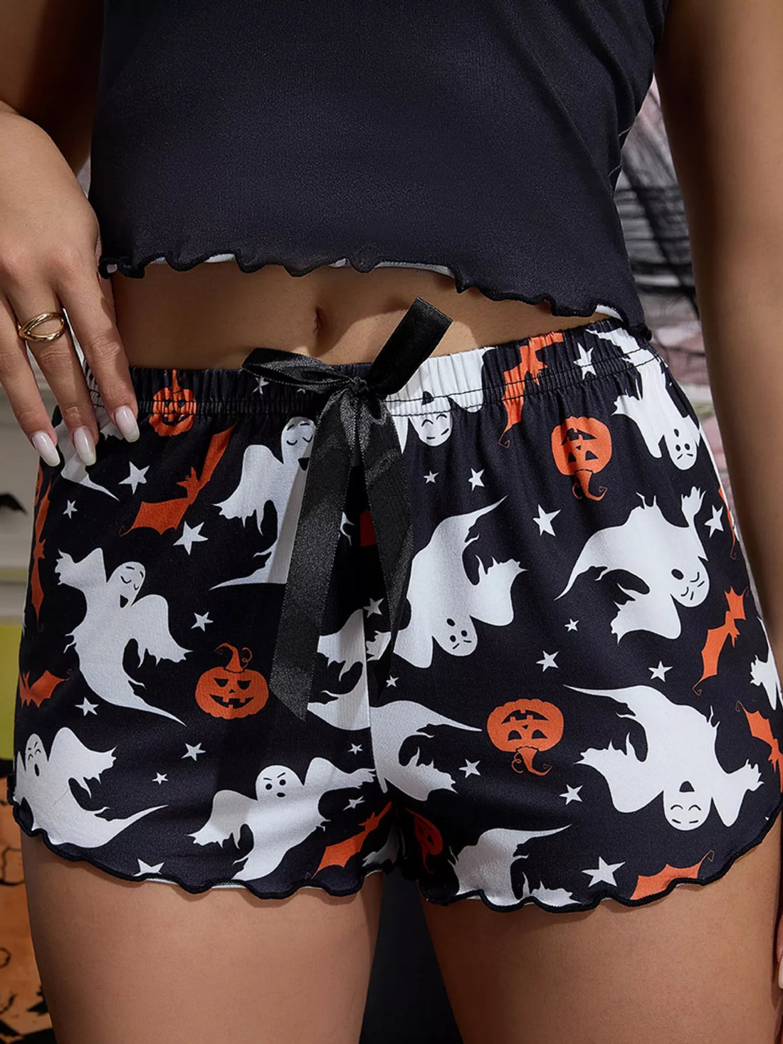 Cami and shorts set: ghost-and-pumpkin print shorts with black elastic waist, lettuce edge