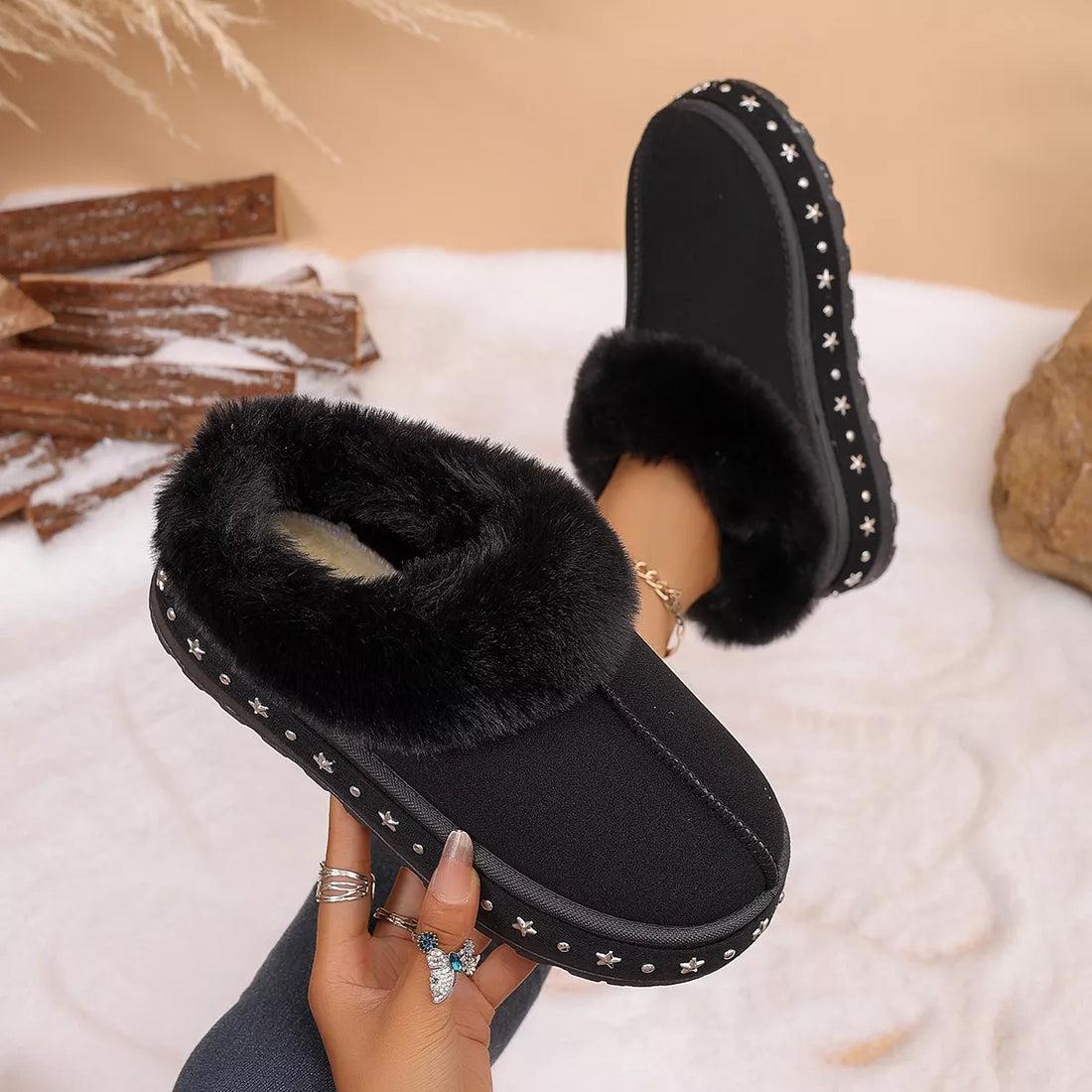 Black faux fur lined platform ankle boots, open cuff showing plush lining and stars