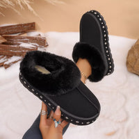 Black faux fur lined platform ankle boots, open cuff showing plush lining and stars