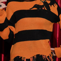Orange and black striped turtleneck sweater with bat graphic, ribbed cuffs, fringe hem