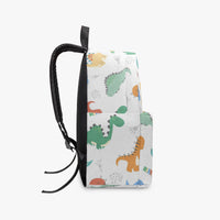 Side view of white dinosaur canvas backpack with black cord tie and straps