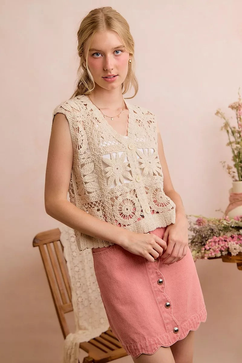 Natural crochet sleeveless vest top with V-neck and granny-square starburst pattern