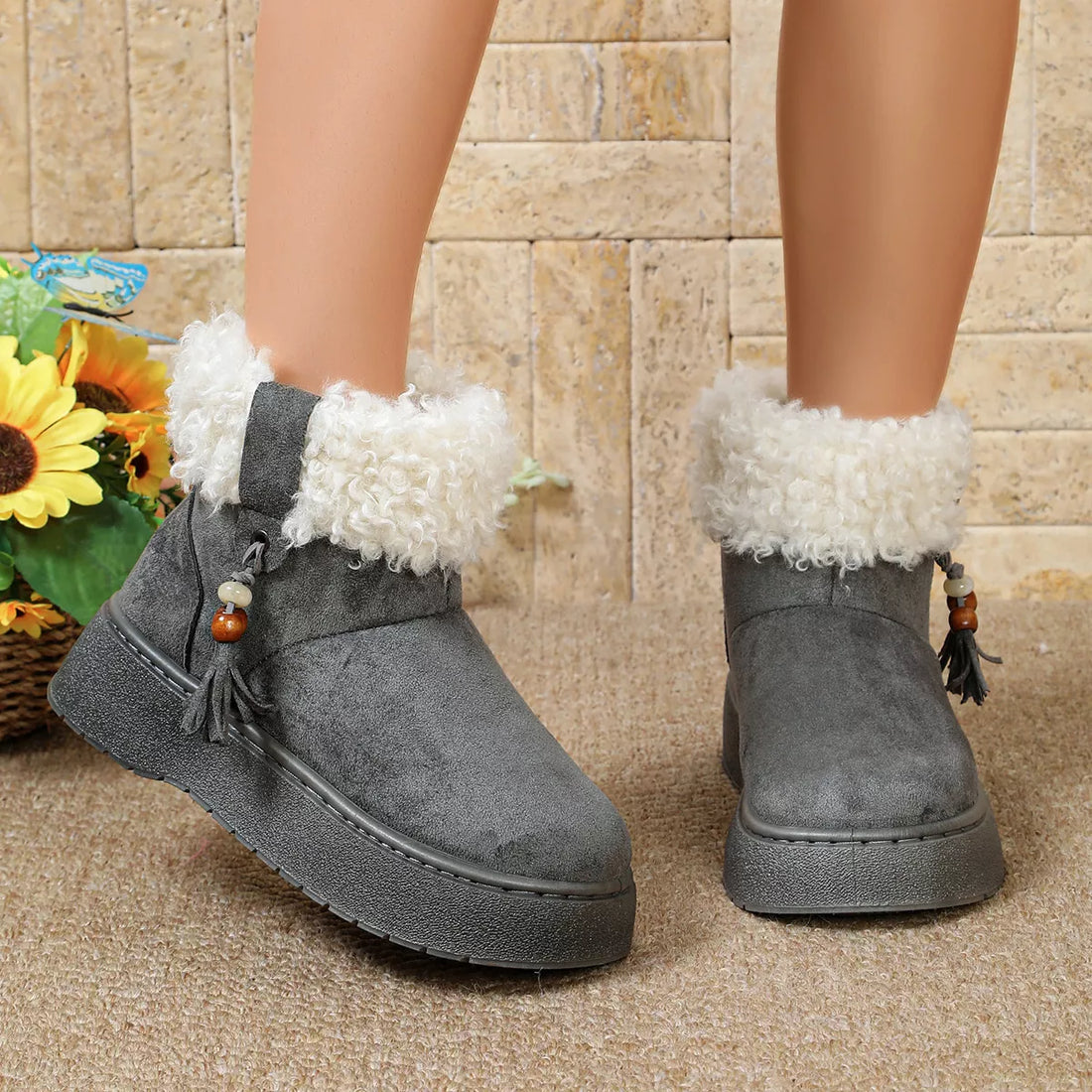 Gray faux suede ankle boots with round toe, faux fur trim and side tassel