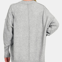 Grey drop-shoulder sweater back view with long sleeves and vertical seam