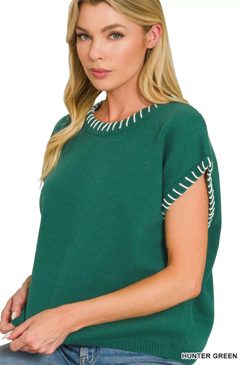 Hunter green knit oversize sweater with contrast stitch trim on neckline and sleeve edge