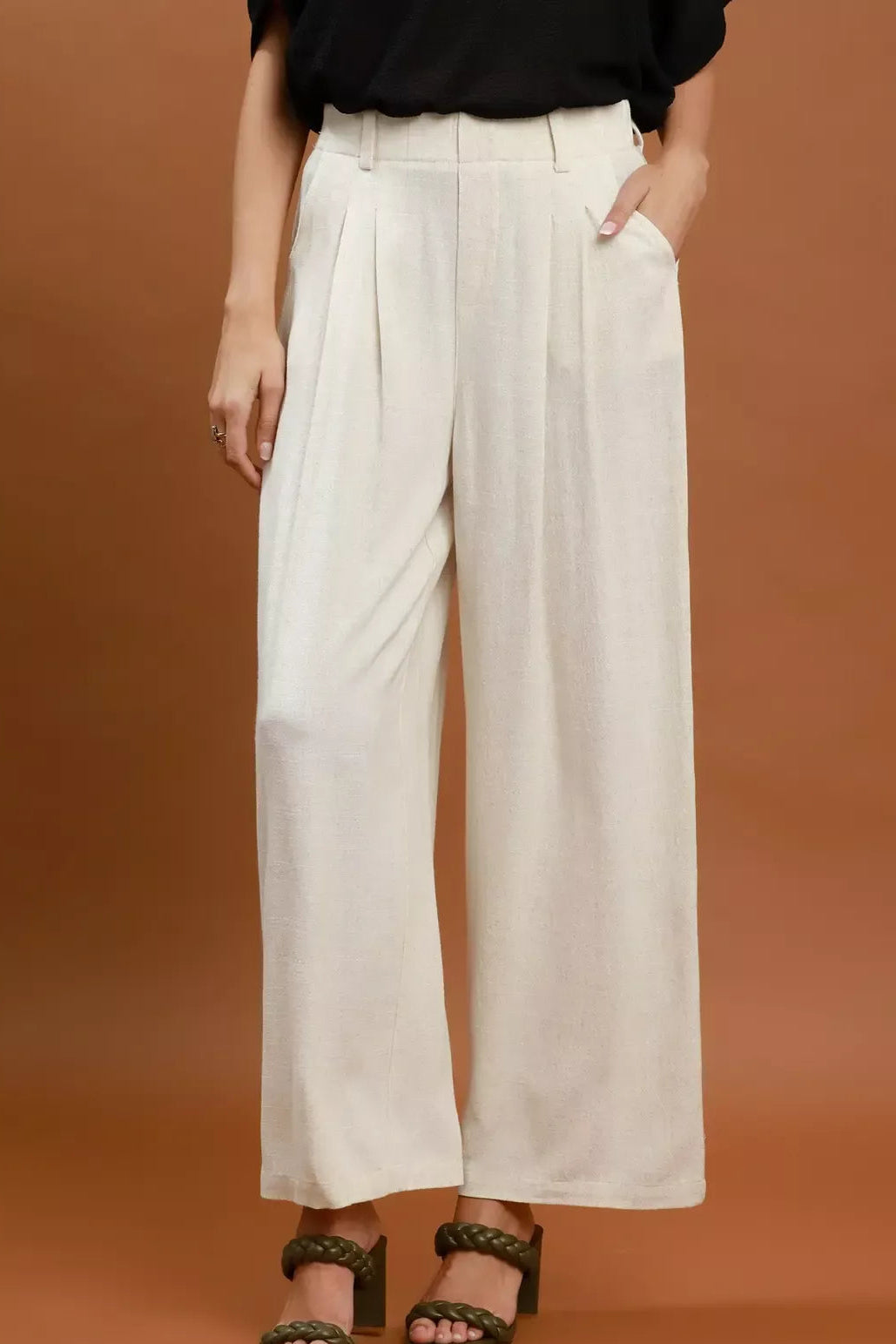 Cream linen-blend wide-leg trousers with high waist and pleated front