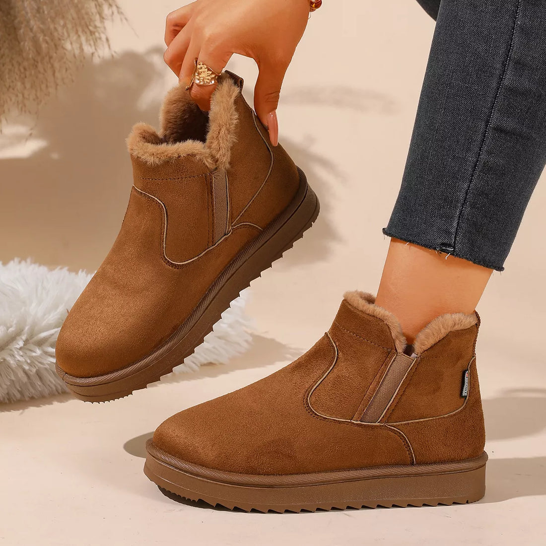 Camel ankle boots with faux fur collar, side elastic panels, and rugged outsole
