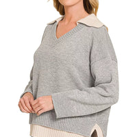 Grey V-neck sweater with knit collar detail and ribbed cuffs, dual-look hem overlay