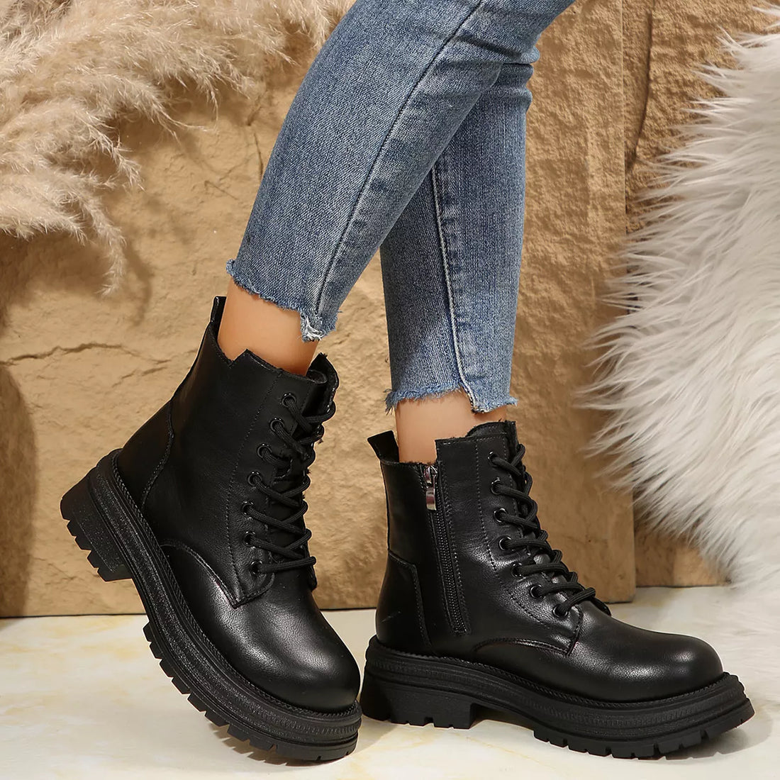 Black lace-up platform round-toe boots with side zipper and lug sole