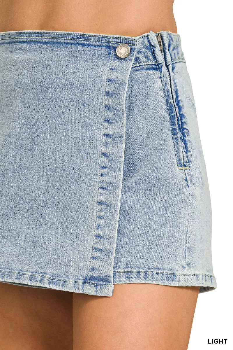 Light wash denim wrap-front skort with front button and tie detail