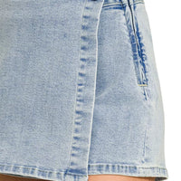 Light wash denim wrap-front skort with front button and tie detail