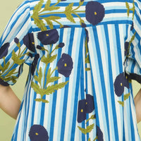 Close-up of blue striped dress back with floral print and navy edging